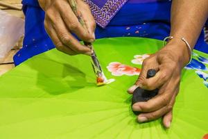 Woman painting umbrella photo