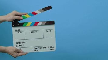 Movie film slate. close up hand clapping empty film slate video