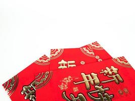 Red envelope isolated on white background for gift Chinese New Year. Chinese text on envelope meaning Happy Chinese New Year photo