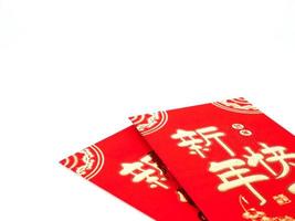 Red envelope isolated on white background for gift Chinese New Year. Chinese text on envelope meaning Happy Chinese New Year photo