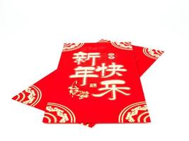 Red envelope isolated on white background for gift Chinese New Year. Chinese text on envelope meaning Happy Chinese New Year photo