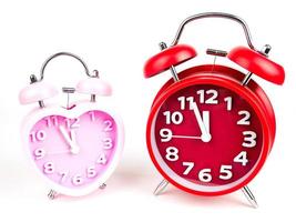 Red and Pink alarm clock in the form of heart isolated on white background, Valentine's Day photo