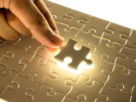 Missing Jigsaw puzzle piece with lighting, business concept for completing the finishing puzzle piece photo