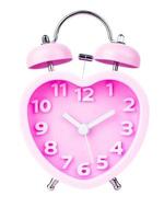 Pink alarm clock in the form of heart isolated on white background, Clipping path photo