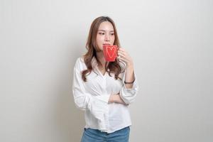 portrait beautiful Asian woman holding coffee cup or mug photo