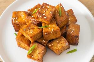fried tofu with white sesame and teriyaki sauce photo