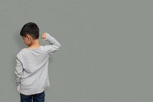 Shirt design and people concept - close up of little boy in plain tshirt front and rear isolated. Mock up template for design print photo