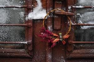 Christmas wreath with flowers photo