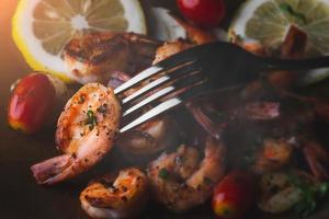 Cooked shrimps with herb seasoning. photo