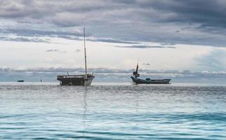 Fishery wooden boats with outdoor sun. photo