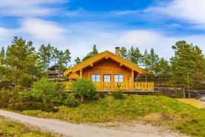 Norwegian wooden cabins cottages in the nature landscape Nissedal Norway. photo