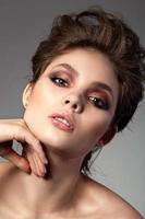 Portrait of beautiful woman with evening makeup