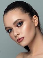 Portrait of young woman with beautiful makeup photo