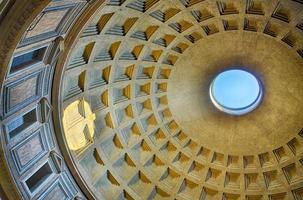 Roman Pantheon from inside with blue sky and sun reflection from cupola hole photo