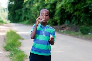 child blowing bubbles. photo