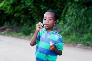 child blowing bubbles. photo