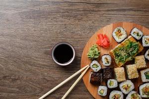Sushi set at round wooden plate