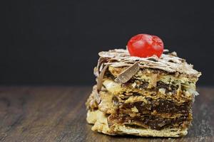 puff pastry cakes on wooden table photo