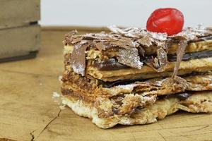 puff pastry cakes on wooden table photo