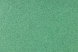 Green offset printed paper background texture. Macro close up. Full frame photo