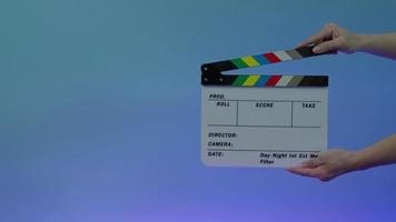 Movie film slate. close up hand clapping empty film slate video