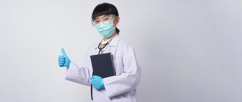 Doctor in uniform points to an empty area. Hand gesture. photo