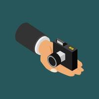 Camera in hand isometric vector