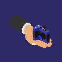 Camera in hand isometric vector