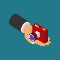 Camera in hand isometric vector