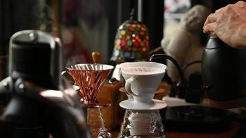 The barista is making coffee in a drip method for customers. video