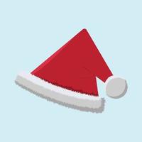 Red Santa Claus hat on blue background. Isolated red hat.
