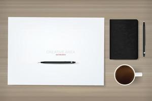 Empty white paper sheet for creative area with a cup of coffee, notebook and pencil on wood background. Vector abstract background of working space.