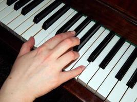 Piano keys hand photo