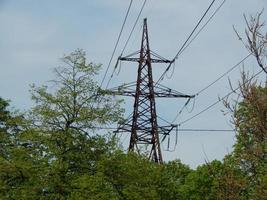 Power lines in the city, strained wires on a metal structure photo