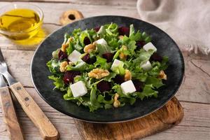 Beetroot salad with feta cheese,lettuce and walnuts photo