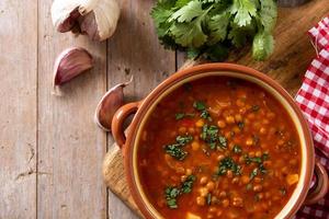 Red lentil soup in bowl photo