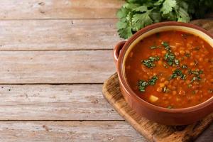 Red lentil soup in bowl photo