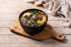 Beef, okra stew and spinach soup in bowl photo