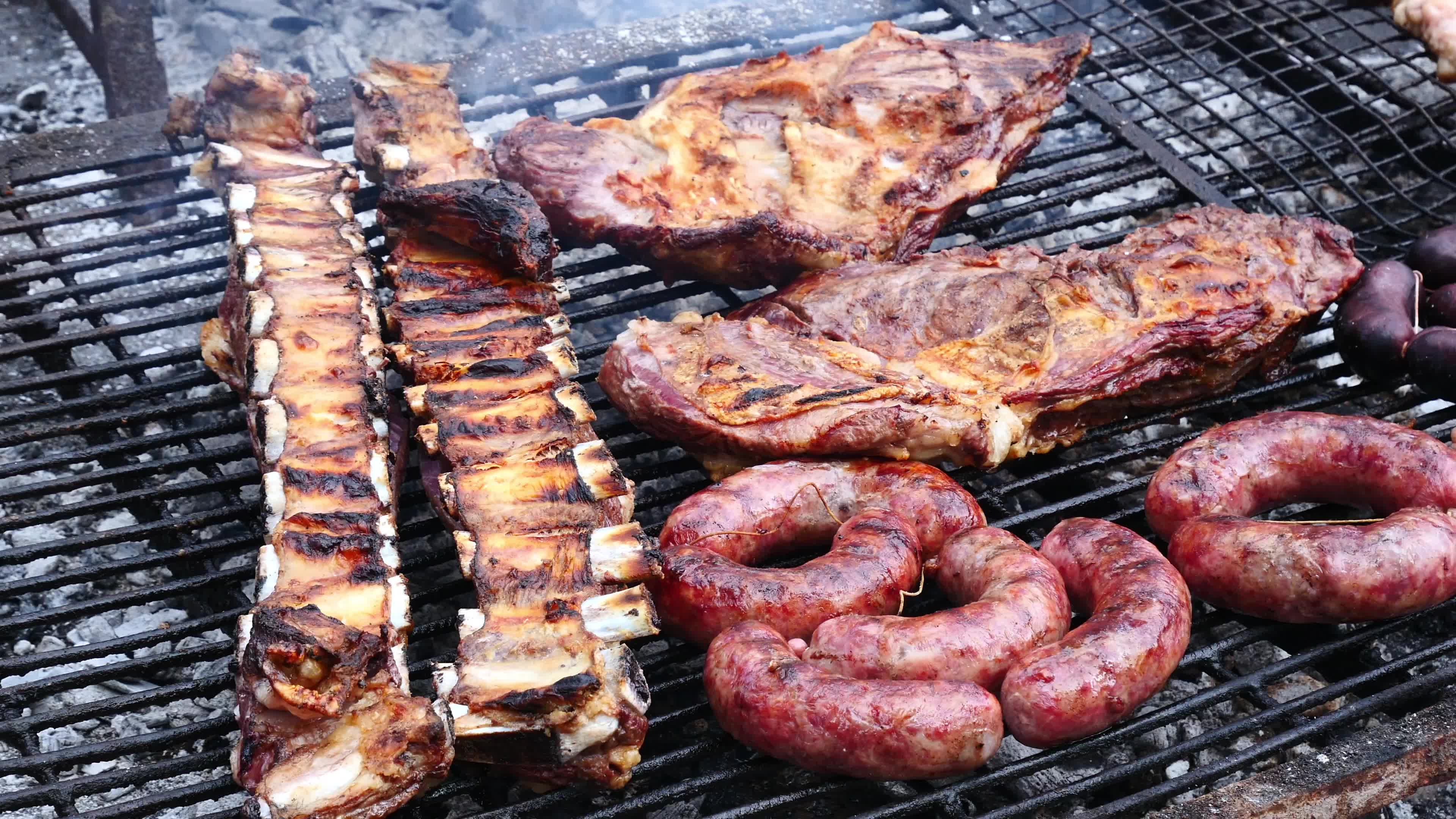 Parrilla Argentina, traditional barbecue with a variety of meats 3697420  Stock Video at Vecteezy