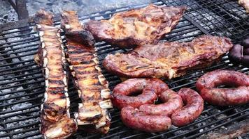 Parrilla Argentina, traditional barbecue with a variety of meats video