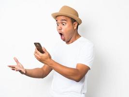Surprised and shocked asian man looking smartphone