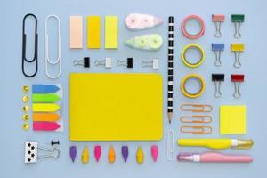 top view colorful office stationery with paper clips erasers photo