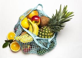 Mesh shopping bag with fruits photo