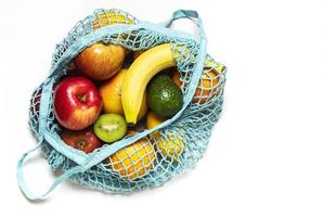 Mesh shopping bag with fruits photo