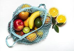 Mesh shopping bag with fruits photo