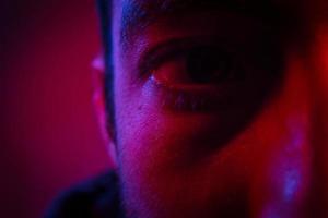 Close up on man face with mysterious facial expression photo