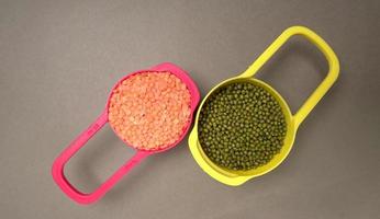 Uncooked pulses,grains and seeds in bowl over grey background. selective focus photo