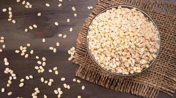 Uncooked pulses,grains and seeds in bowl over grey background. selective focus photo