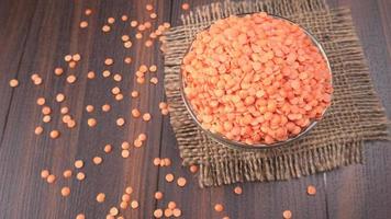 Uncooked pulses,grains and seeds in bowl over grey background. selective focus photo