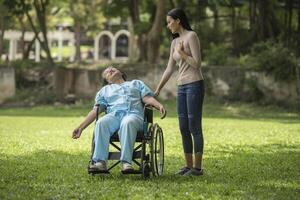 The daughter was shocked to see the shock on her mother sitting on wheelchair. photo